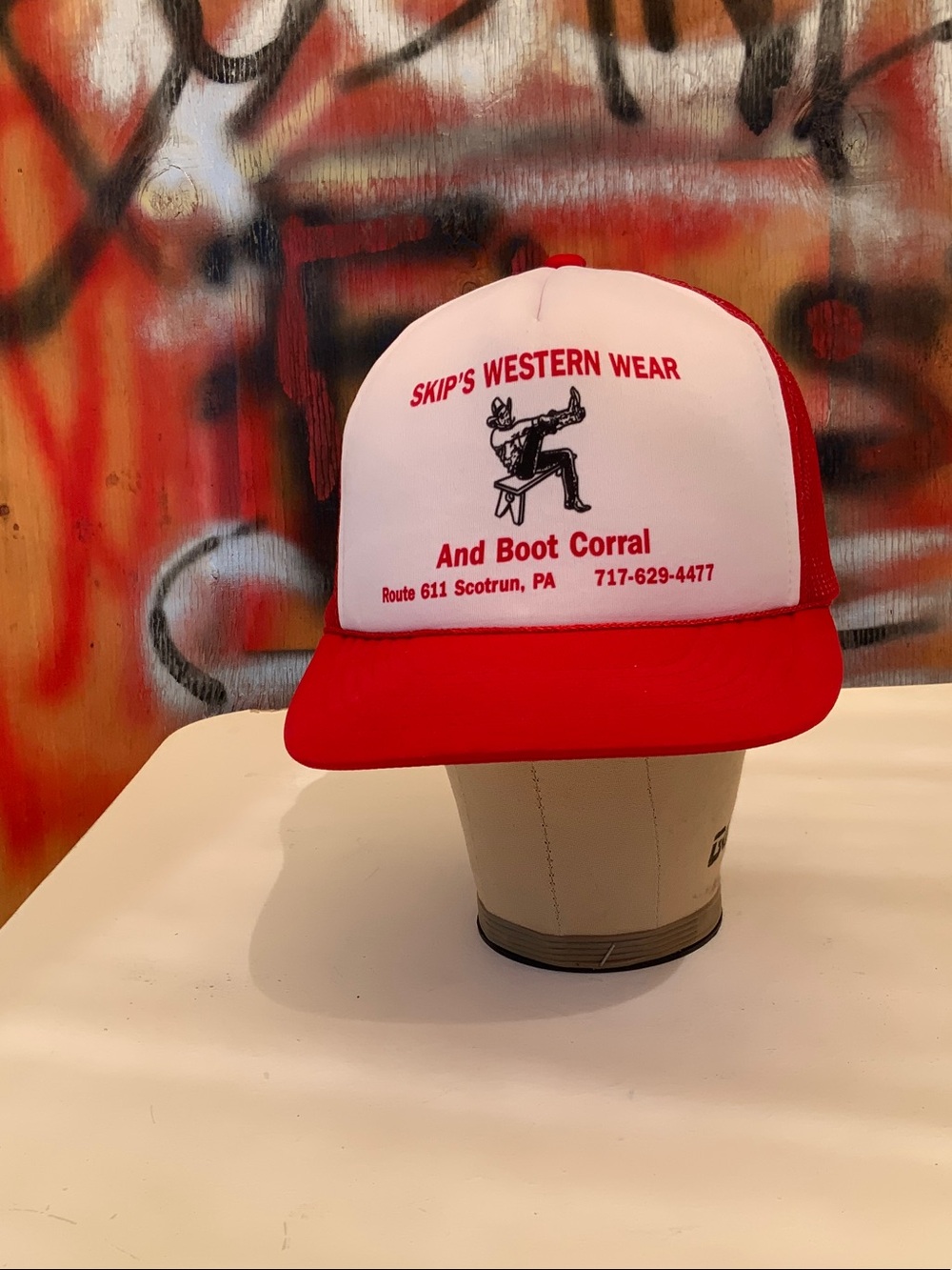 Hat with boot shop text